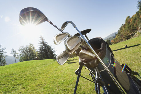 Italy, Kastelruth, Golf clubs in golf bag on golf course - WESTF016387