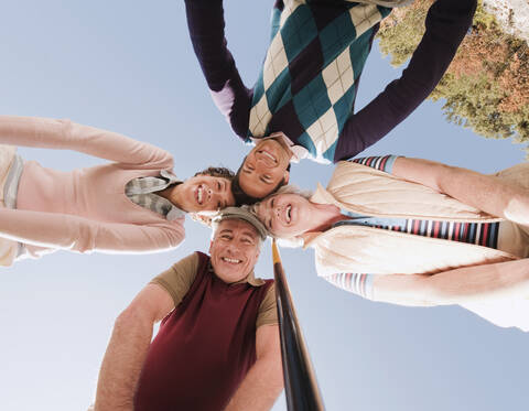 Italy, Kastelruth, Golfers on golf course, smiling, portrait stock photo