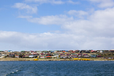 South Atlantic, United Kingdom, British Overseas Territories, East Falkland, Falkland Islands, Falklands, Port Stanley, Stanley, View of sea with buildings in background - FOF003231