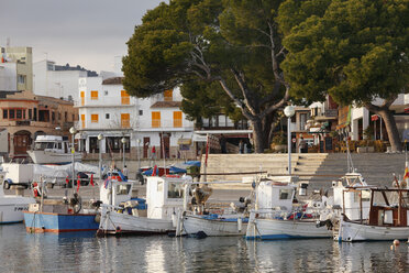 Spain, Balearic Islands, Majorca, Cala Ratjada, View of moored boat with buildings in background - SIEF000804