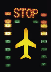 Germany, Lights with aircraft and stop sign on tower in airport - WBF000911