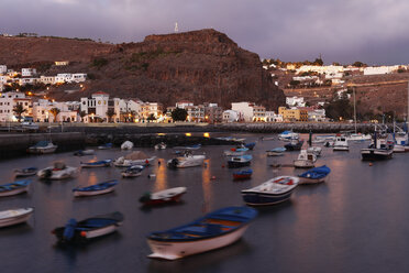 Spain, Canary Islands, La Gomera, Playa de Santiago, View of buildings at dusk - SIEF000859