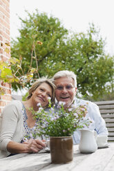 Germany, Kratzeburg, Senior couple smiling, portrait - WESTF016694