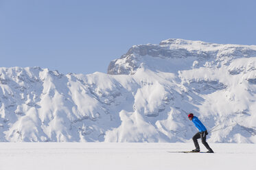 Italy, Trentino-Alto Adige, Alto Adige, Bolzano, Seiser Alm, Mid adult man doing cross-country skiing - MIRF000196