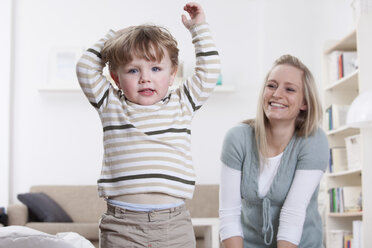 Germany, Bavaria, Munich, Mother and son playing at home - RBF000688