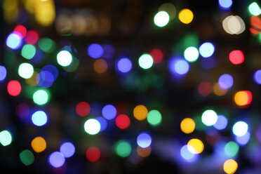 Germany, Munich, Illuminated fairy lights at christmas night, defocussed - TCF001434
