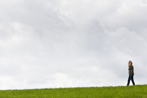 Germany, Bavaria, Woman walking on meadow - FOF003348