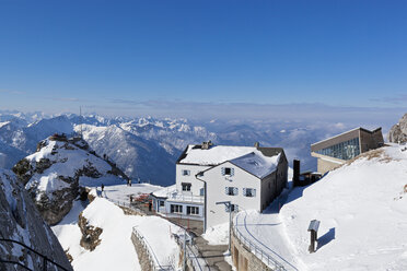 South Germany, Upper Bavaria, Bayrischzell, View of house, restaurant and cable car station on Wendelstein mountain - FO003389