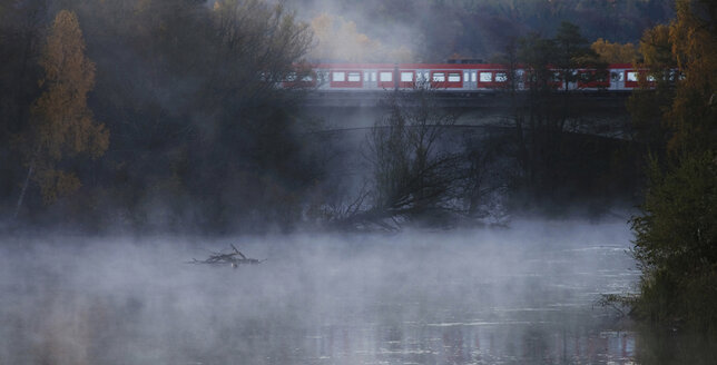 Germany, Bavaria, Amper, View of train in mist at morning - MOF000160