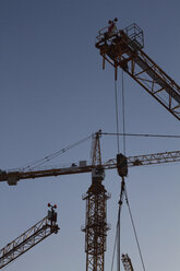 Austria, Vienna, Donau City, View of cranes at contruction of DC Towers - MBEF000102