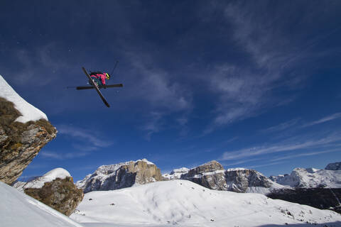 Italy, Sella, Dolomites, Man doing freestyle skiing stock photo