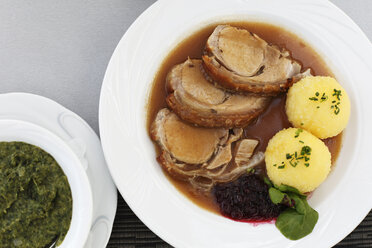 Germany, Bavaria, Franconia, Upper Franconia, Close up of suckling pig meat with dumplings - SIEF001492