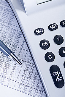 Close up of business document with calculator and pen - TSF000251