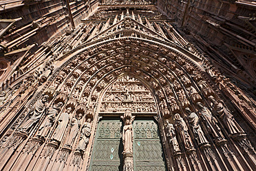 France, Alsace, Strasbourg, View of Notre Dame cathedral with decorated door - WDF000921