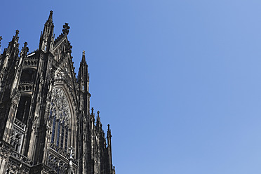 Germany, Cologne, View of Cologne Cathedral against blue sky - GWF001489