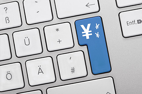 Illustration of keyboard having blue key with yen symbol, close up - TSF000305