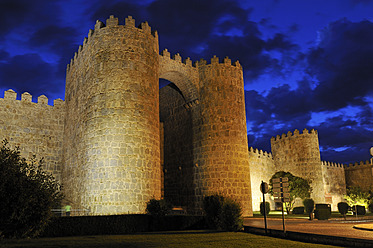 Europe, Spain, Castile and Leon, Avila, View of medieval city wall and Puerta de los Leales at night - ESF000068