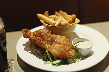 Republic of Ireland, County Fingal, Skerries, Close up of fish and chips in plate - SIEF001589