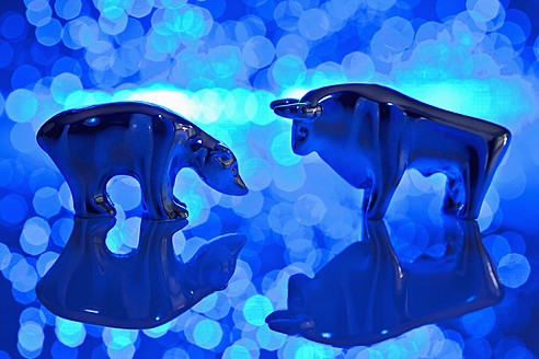 Close up of bear and bull figurine with blue fiber lights - TSF000311