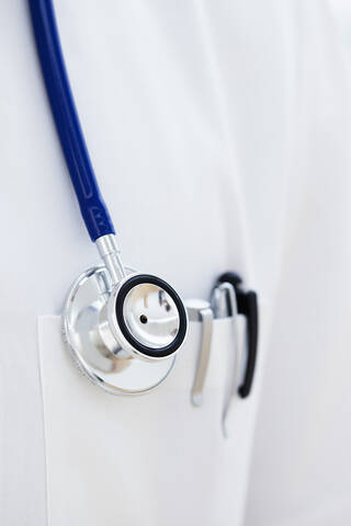 Germany, Bavaria, Diessen am Ammersee, Close up of stethoscope and pen in doctor's lab coat stock photo