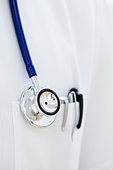 Germany, Bavaria, Diessen am Ammersee, Close up of stethoscope and pen in doctor's lab coat - JRF000173