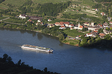 Austria, Lower Austria, Wachau, Schwallenbach, View of village near riverside with boat in foreground - SIEF001662