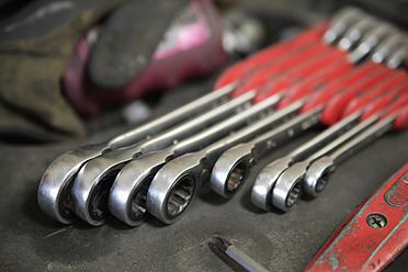 Germany, Ebenhausen, Close up of various spanners in repair garage - TCF001641