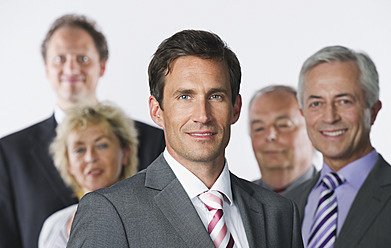 Business people against white background, smiling - WESTF016994
