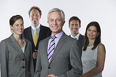 Business people against white background, smiling, portrait - WESTF016996