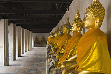 Thailand, Ayutthaya, Row of buddha statues in temple - HKF000451