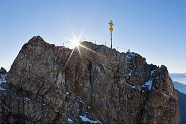 Austria, Germany, Bavaria, Bavarian Alps, View of cross on summit of Zugspitze and wetterstein mountain - FOF003581