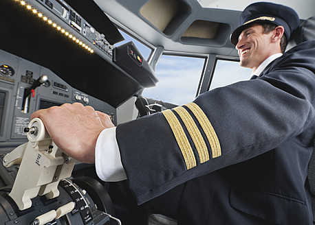 Germany, Bavaria, Munich, Pilot piloting aeroplane from airplane cockpit - WESTF017048