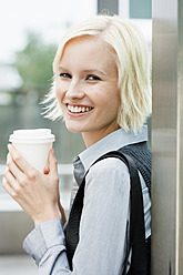 Germany, Bavaria, Munich, Young woman smiling, portrait - SPOF000043