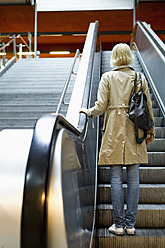 Germany, Bavaria, Munich, Young woman on escalator in metro station - SPOF000011