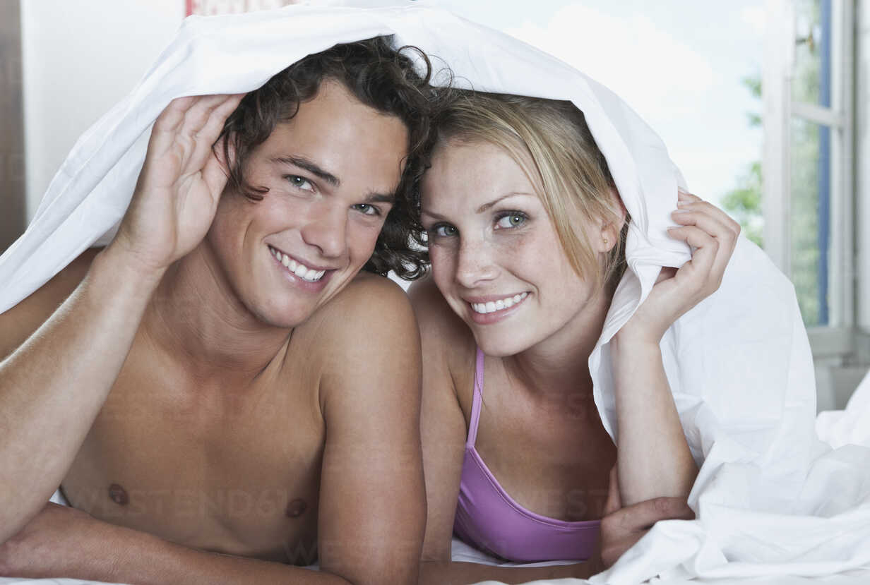 Couple With Towel In The Hotel Room Flirting Stock Photo, Royalty-Free