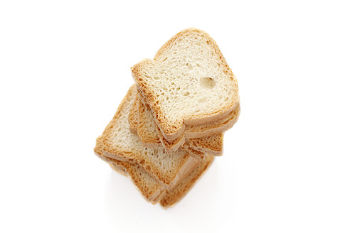 Stack of toast on white background, close up - HSTF000001