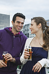 Germany, Berlin, Couple drinking beverages - WESTF017573