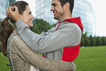 Germany, Berlin, Couple embracing in park - WESTF017597