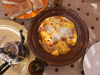 Morocco, Rissani, Tajine with eggs and a pot of tea - BSCF000068