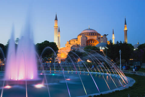 Turkey, Istanbul, Sultanahmet, People watching light show of fountain with Haghia Sophia in background stock photo