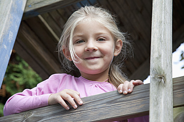 Germany, Bavaria, Huglfing, Girl in garden, smiling, portrait - RIMF000028