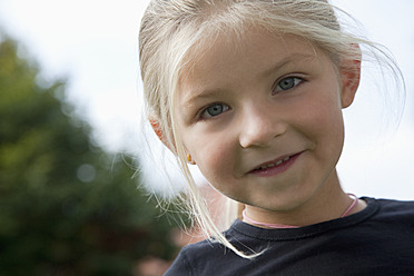 Germany, Bavaria, Huglfing, Girl in garden, smiling, portrait - RIMF000033