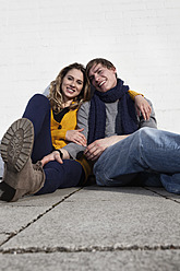 Germany, Bavaria, Munich, Young couple smiling, portrait - RBF000736