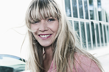 Portrait of a young woman smiling in Cologne, Germany - WESTF017913