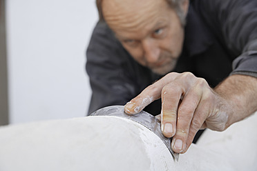 A sculptor is seen working with gypsum in Schaeftlarn, Munich, located in Upper Bavaria, Germany - TCF001987