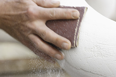 A sculptor is seen polishing plaster in Schaeftlarn, a town located in Upper Bavaria near Munich, Germany - TCF001991