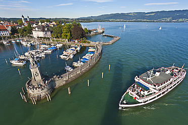 Scenic view of Lindau's bustling port, featuring an excursion boat, in the charming region of Bavaria, Germany - WD001068