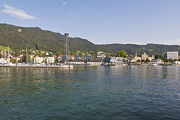 Scenic view of a tour boat sailing on the tranquil waters of Vorarlberg's picturesque lake in Austria - WD001101