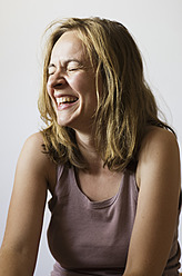 Close-up of a mid-adult woman smiling on the beautiful Ionian Island of Ithaca, Greece - MUF001136