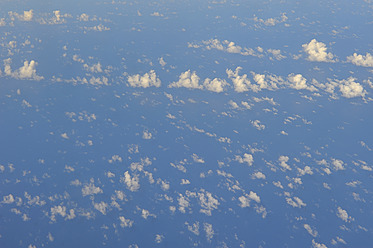 Aerial view of Caribbean Sea and clouds from airplane window - RUEF000730